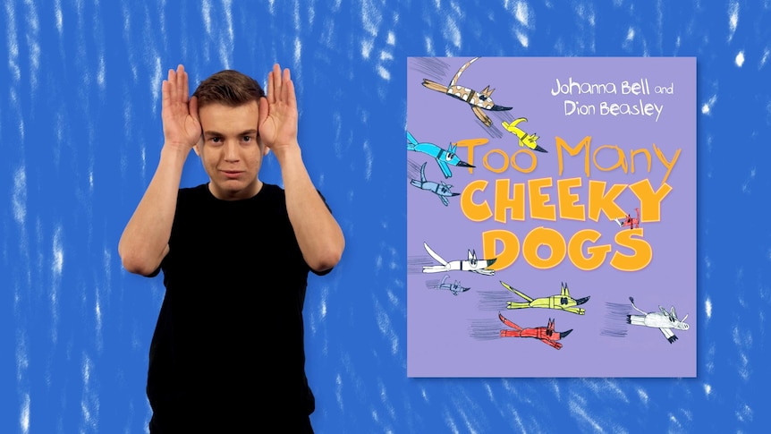Auslan presenter Calvin Black stands beside image of book, Too Many Cheeky Dogs
