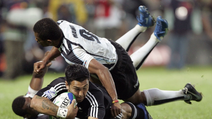 New Zealands Rene Ranger is tackled by Fijis Tomasi Mawi during the IRB World Rugby Sevens final