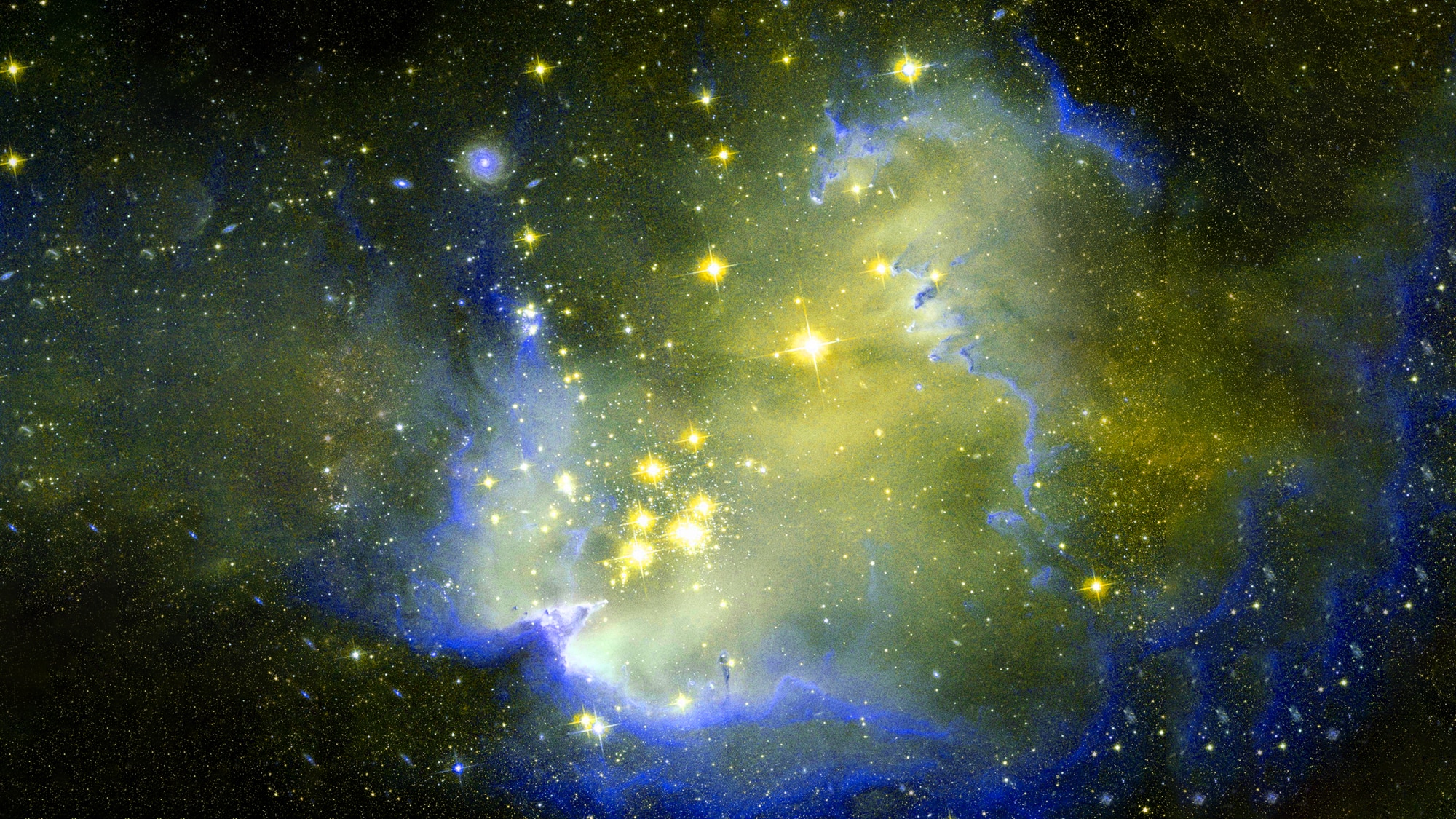 Yellow and blue galaxy with bright yellow starts