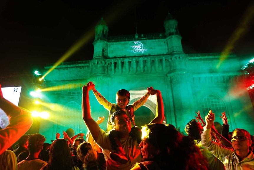 People celebrates New Year's eve in front of the iconic Gateway of India.