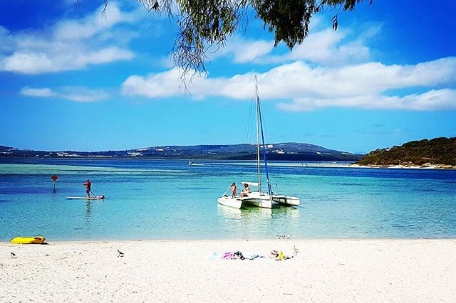 A yacht moors in the calm waters of Emu Point bay, southern Western Australia