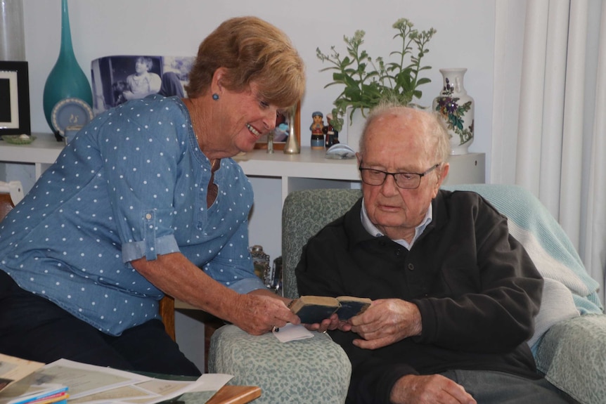 Desmond Illingworth and Ann-Maree O'Keefe look at the diary.