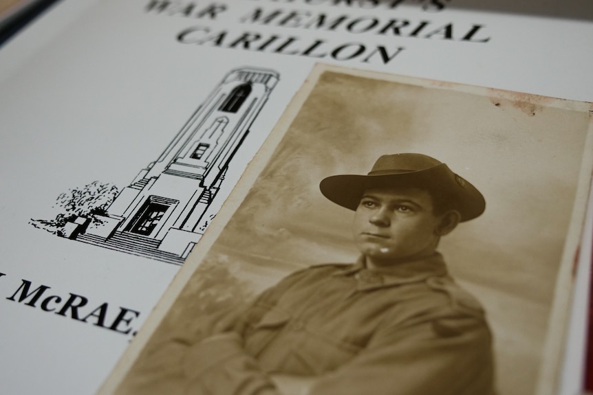 A black and white photo of a young soldier on top of a piece of paper that reads "Bathurst's War Memorial Carillon".