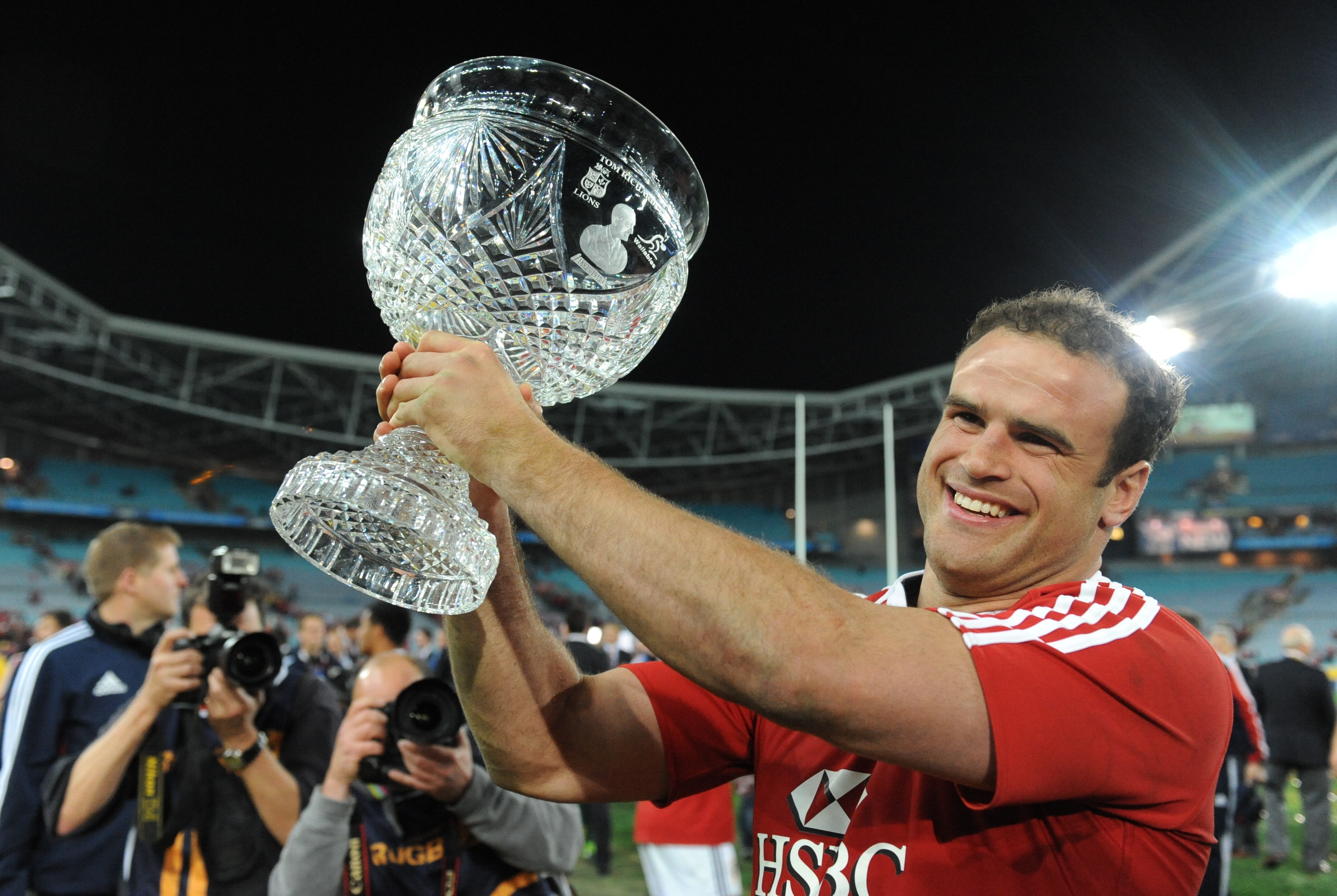 The British and Irish Lions Jamie Roberts holds up the trophy aloft