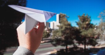Throwing a paper aeroplane