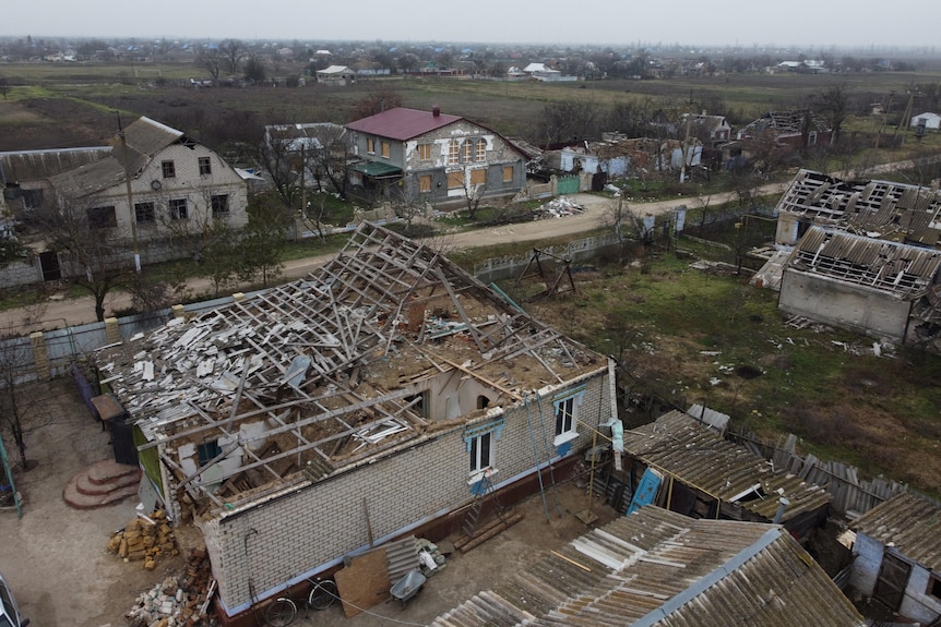 View from above of a house that has had its roof destroyed. 