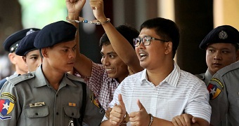 Detained Reuters journalist Wa Lone and Kyaw Soe Oo arrive at Insein court.