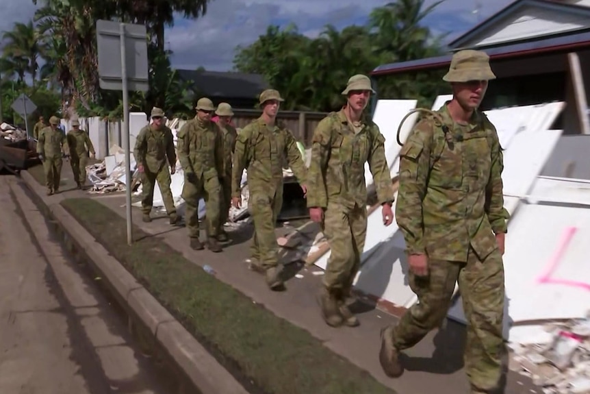 Troops walking on a street