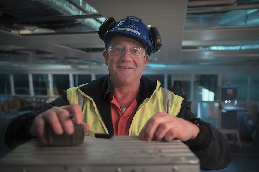 Worker in hardhat at the Incat manufacturing plant.