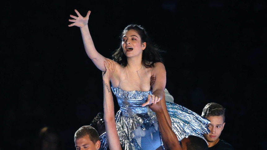 Singer Lorde is lifted on stage as she performs at the MTV Video Music Awards