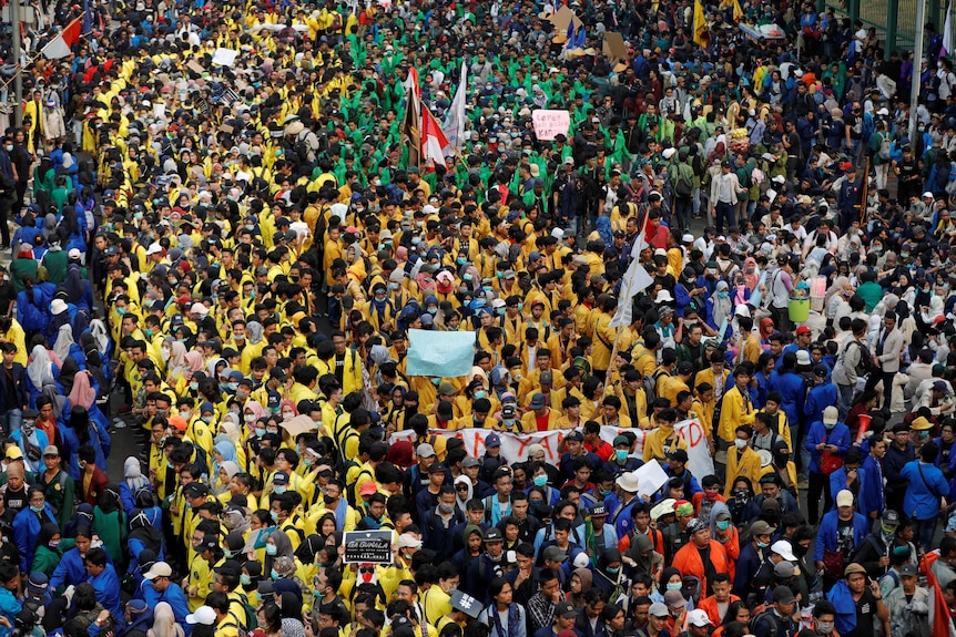 Tens of thousands of students in colourful university jackets hit the streets.jpg