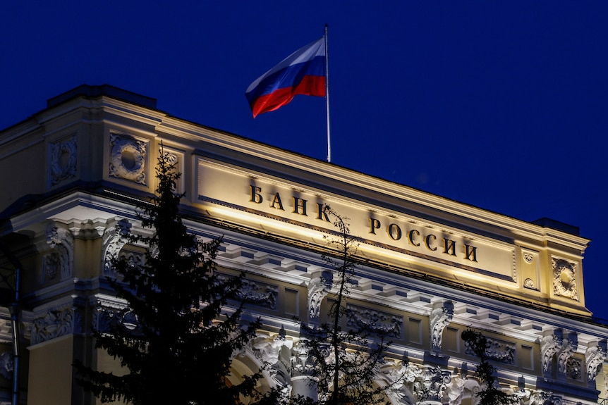 National flag flies over the Russian Central Bank headquarters in Moscow.
