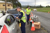 Police officers take saliva swabs from drivers to test for the presence of drugs in motorists in Nimbin.
