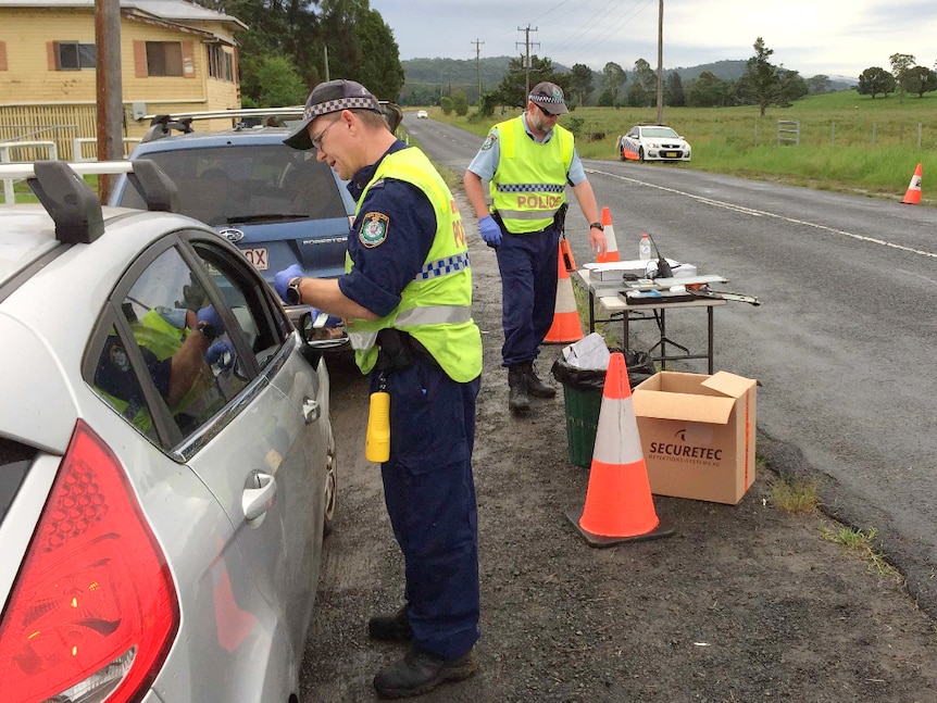 Police officers take saliva swabs from drivers to test for the presence of drugs in motorists in Nimbin.