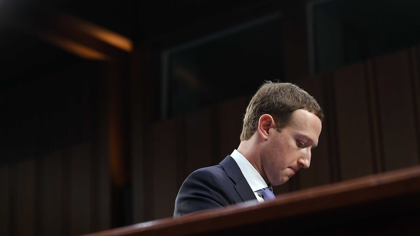 Mark Zuckerberg looks downwards, during the hearing.