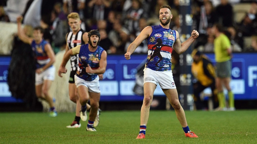 Western Bulldogs' Matthew Suckling reacts after kicking a goal against Collingwood.