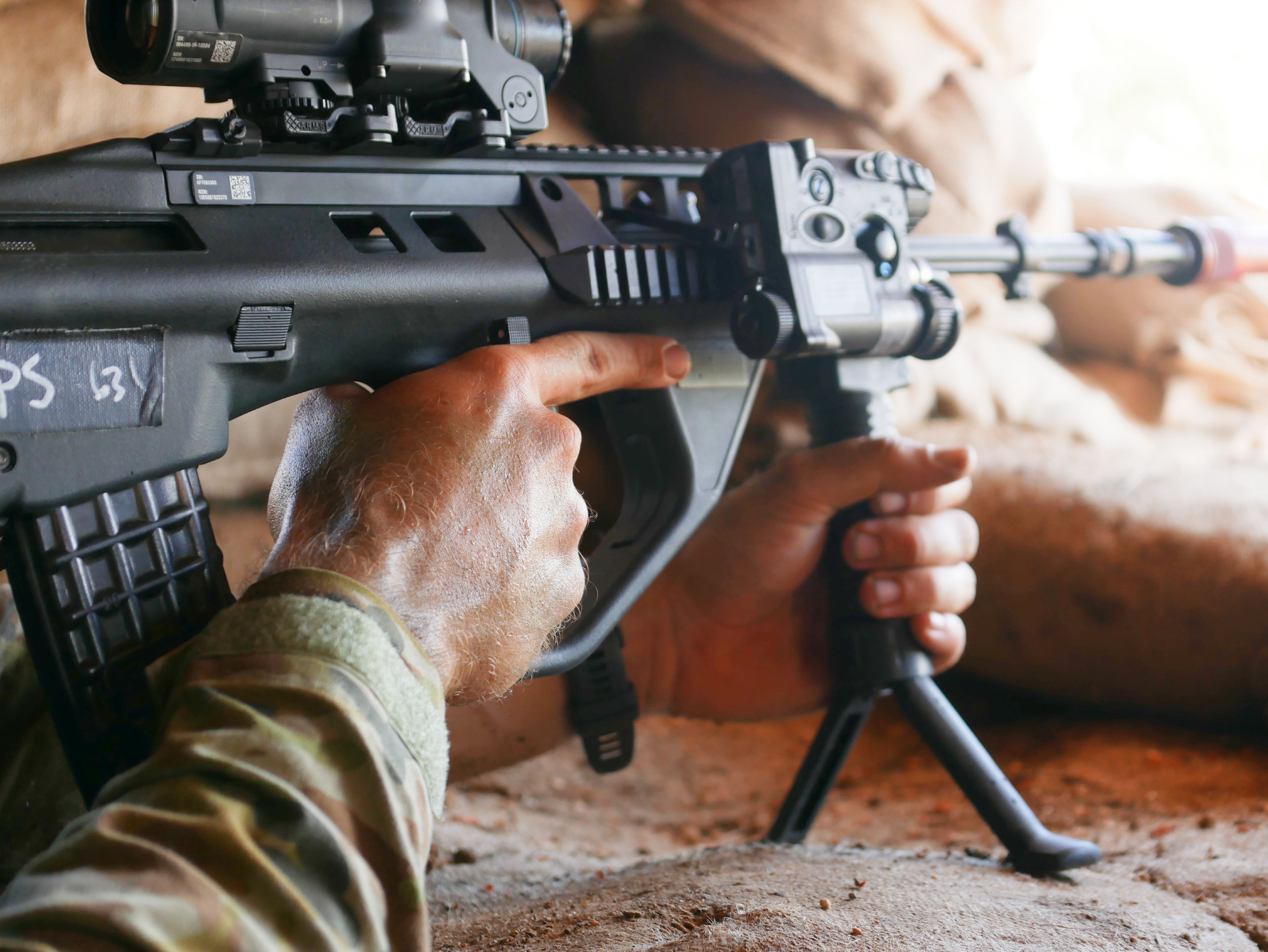 Close up on man's hand on firearm 