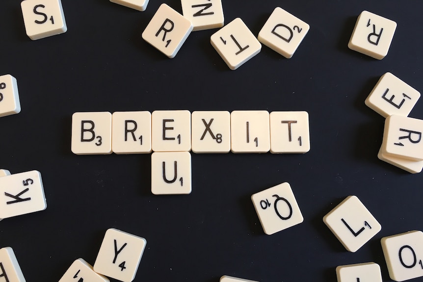 Scrabble tiles spell out 'Brexit' and 'EU'