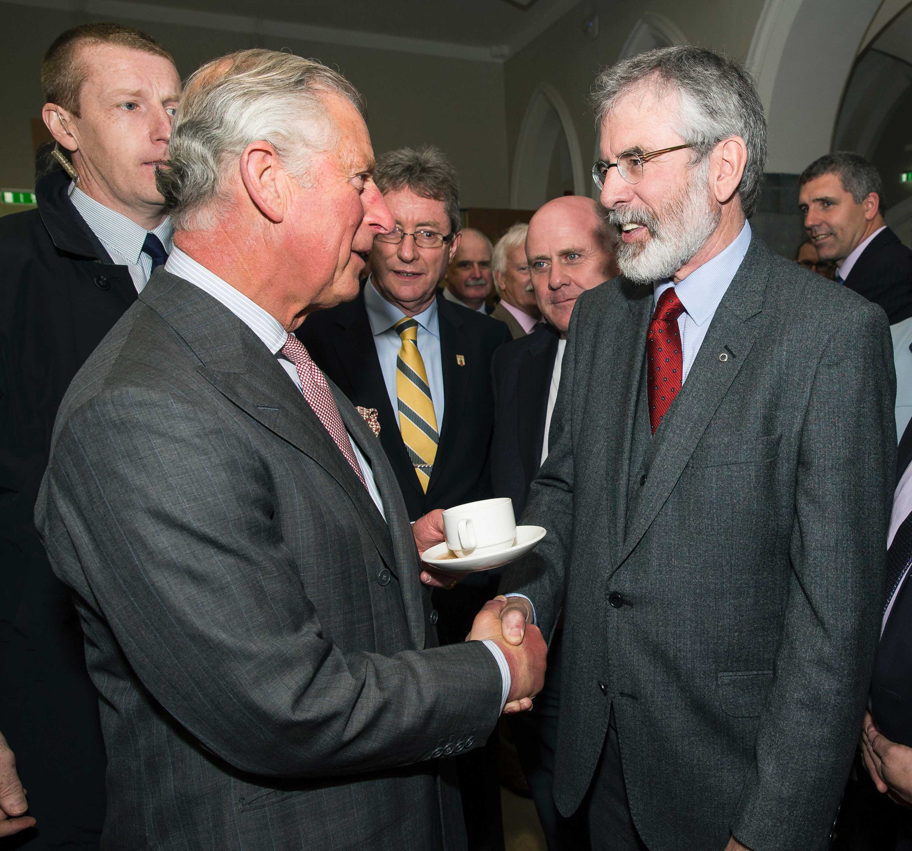 Prince Charles shakes hands with Sinn Fein leader Gerry Adams during