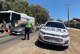 Police direct drivers into a drug testing van.