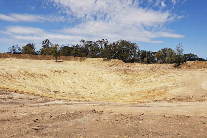 An empty farm dam