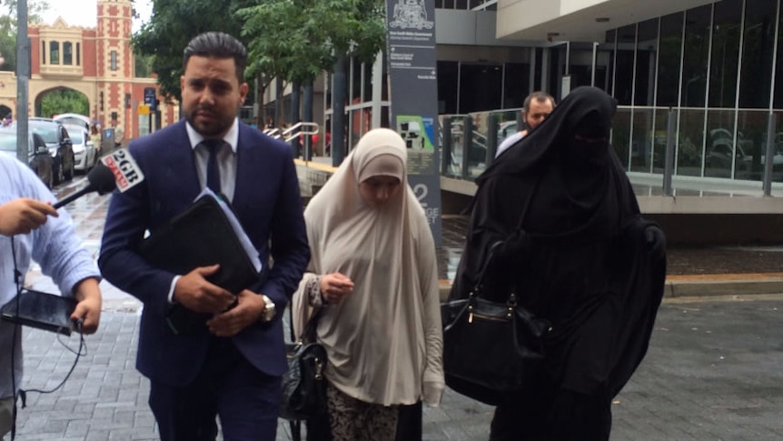 Sameh Bayda's lawyer Fadi Abbas with two women supporters outside Parramatta Bail Court.