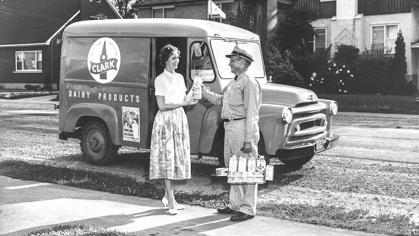 black and white picture of woman and milkman