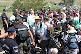 Thousands of migrants cross Macedonia and Serbia heading to EU