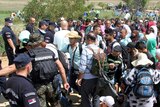 Thousands of migrants cross Macedonia and Serbia heading to EU