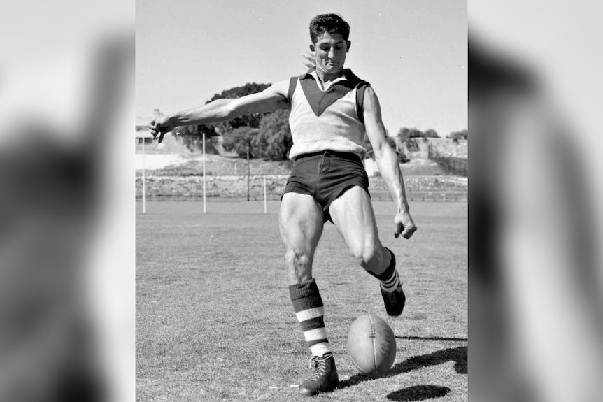 A footballer named John Todd kicks the ball in a black and white image.