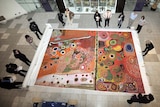 Big picture: museum staff unveil Ngurrara, an 8x5 metre canvas.
