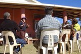 Cash incentive: A Government team at the Wallace Rockhole community west of Alice Springs