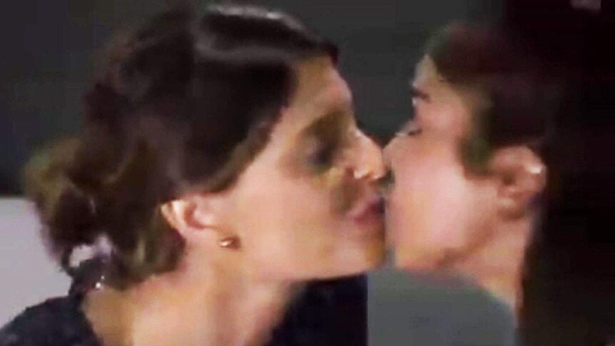 Two gay characters kiss in a scene on Home and Away.
