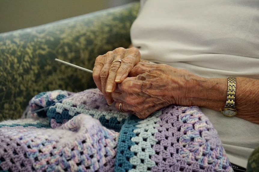 Knitting hands rug.jpg
