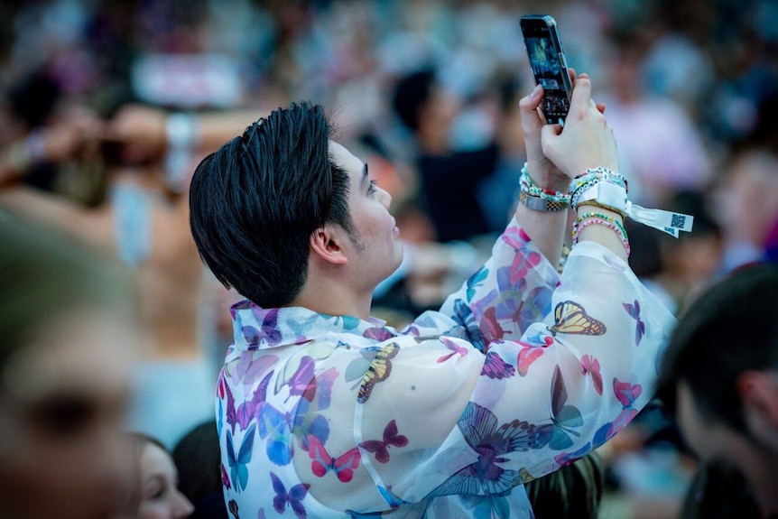 Fan takes a picture at taylor swift show in sydney