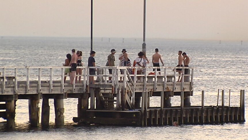 People gather at the pier at South Melbourne.
