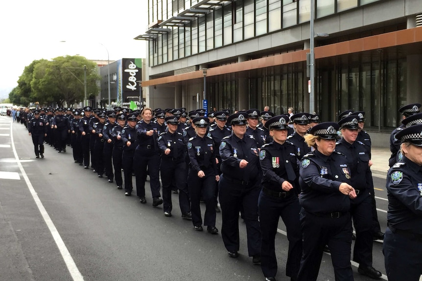 Officers march as part of women in force celebrations