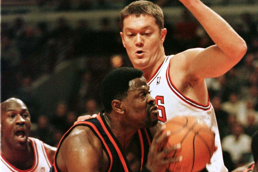 a bulls player blocks a knicks player