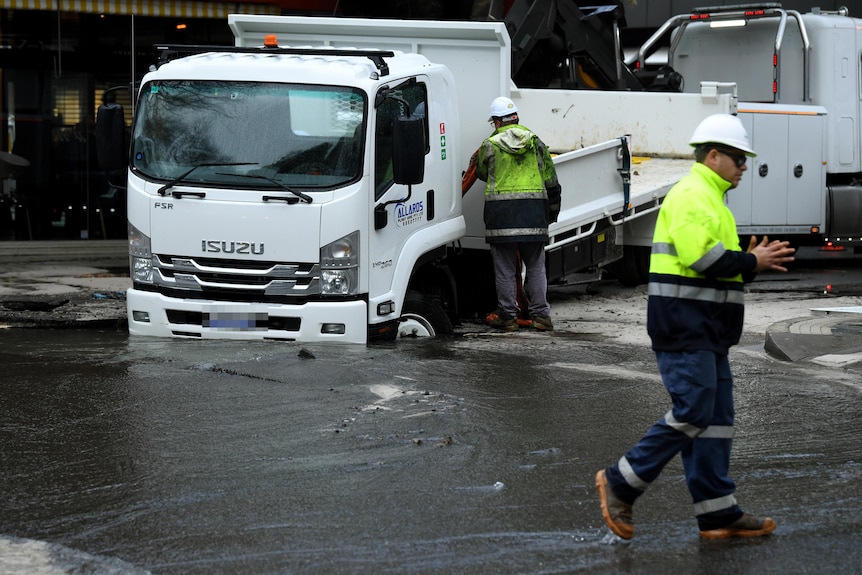 A truck stuck in a sinkhole at Double Bay in Sydney,