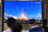 People in South Korea watching the country's first lunar orbiter Danuri being launched on TV