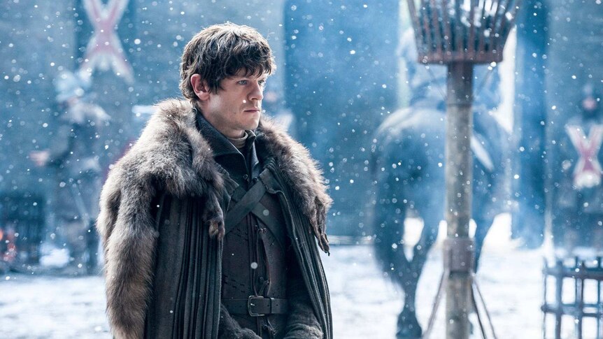 Ramsay Bolton in season six of Game of Thrones stands in the snow.