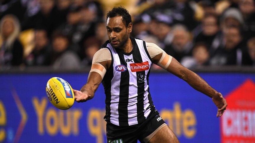 Travis Varcoe grabs the ball during a game