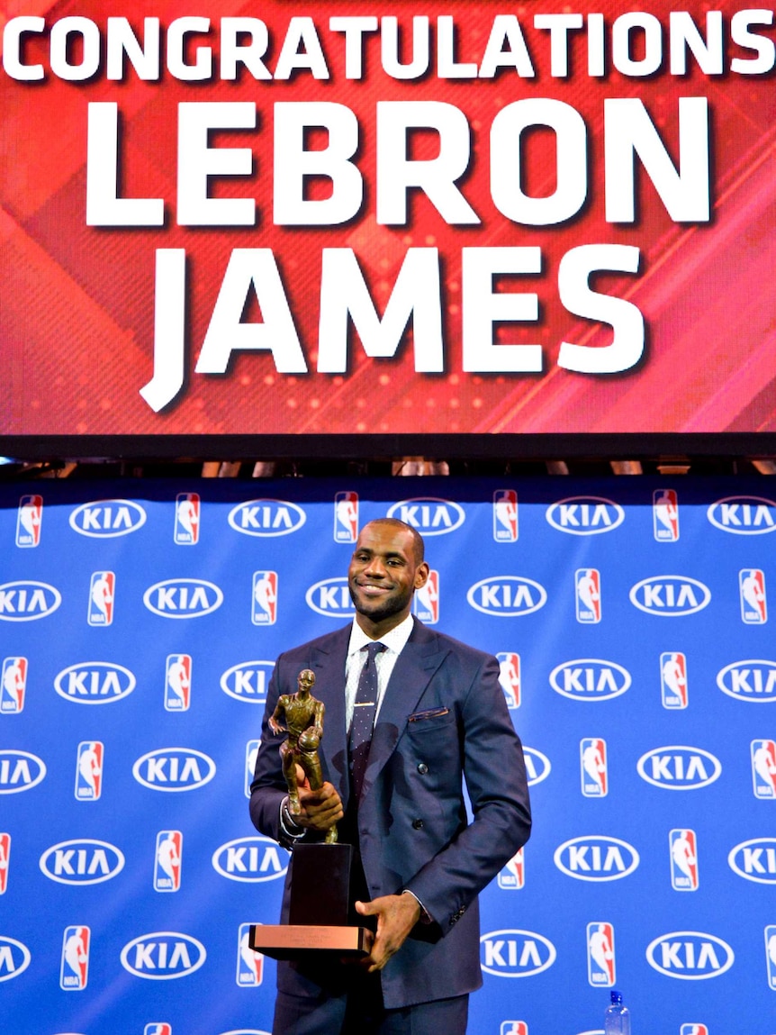 Best of the best ... LeBron James holds the Maurice Podoloff Trophy.