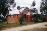 Guildford Primary School, a red brick building, in the Central Victorian town of Guildford.