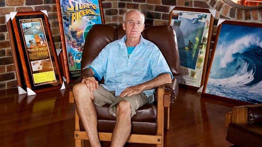 Surf photographer Dick Hoole at home surrounded by memorabilia