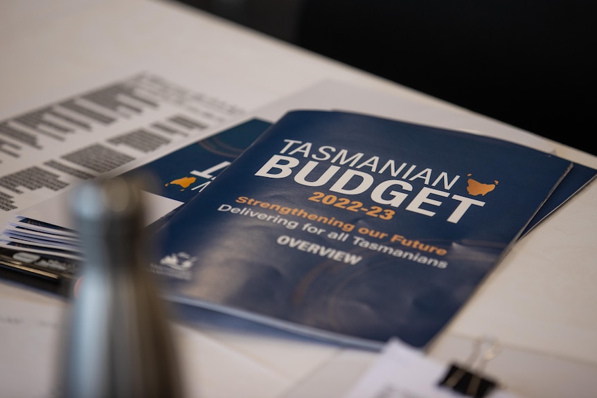 The Tasmanian Budget booklet lies on a table.