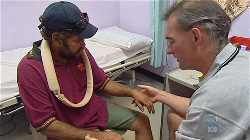 A doctor treating an Indigenous patient at a remote health clinic