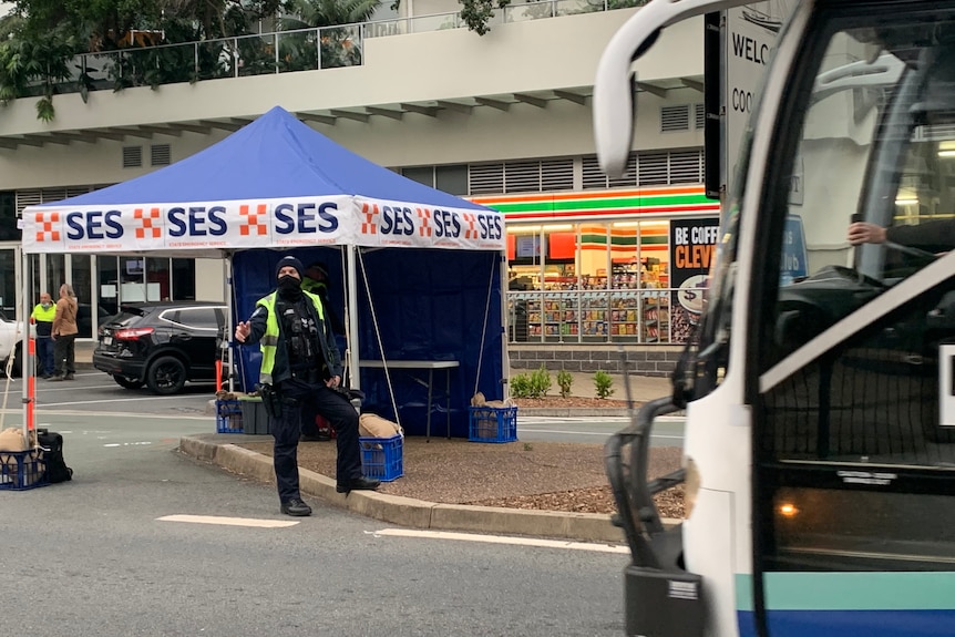 A bus goes through a police check point on Friday morning at Coolangatta.