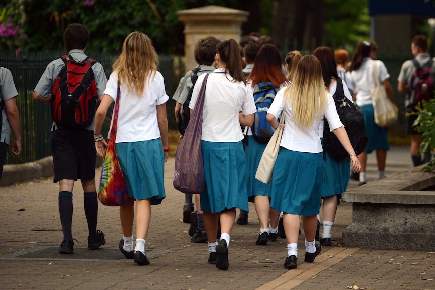 A group of students walk together in Brisbane.