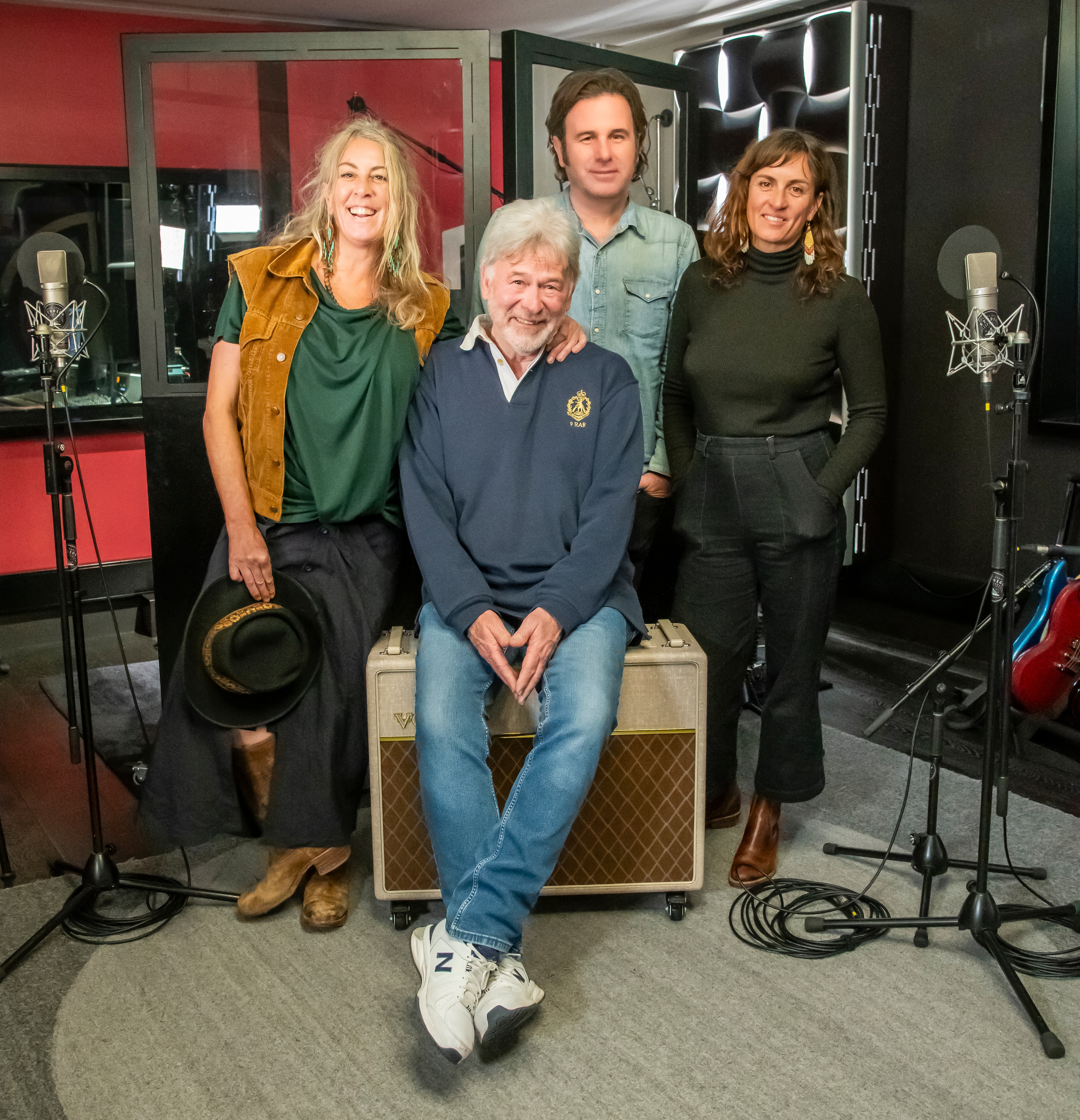 John Schumann with The Waifs band members Donna Simpson, Josh Cunningham and Vikki Thom stand together at the recording studio.